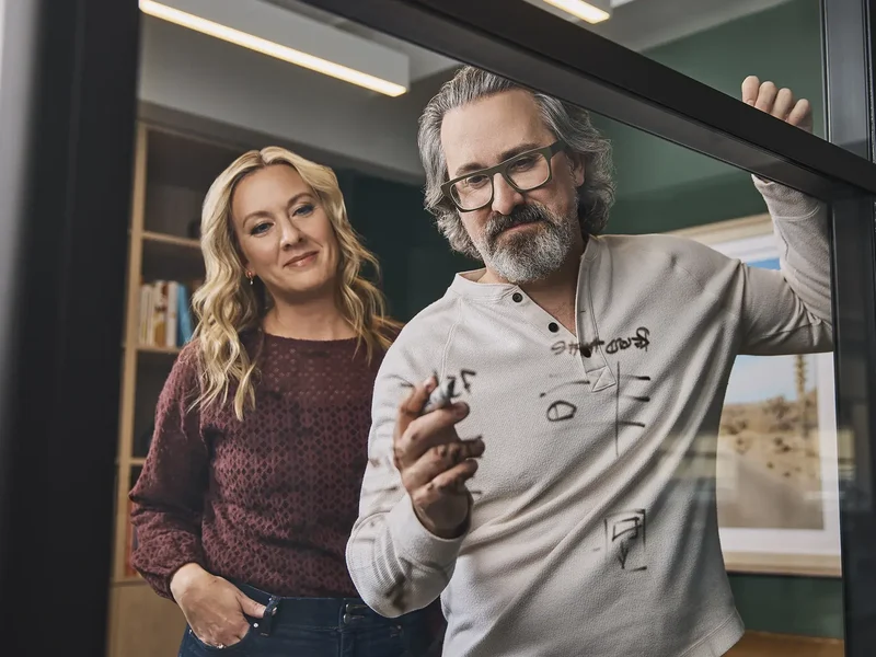 Jeffrey and Nicole strategizing in the Regina office